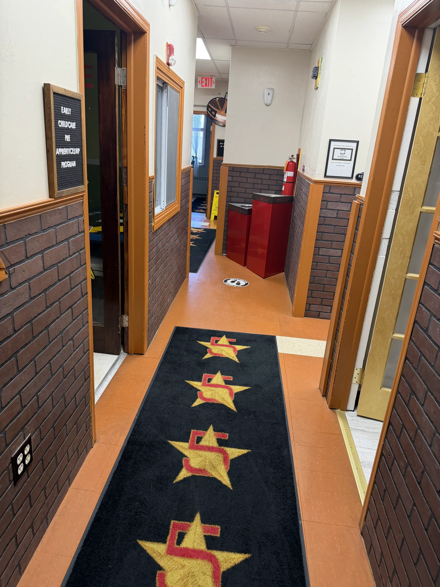 Interior corridor with 5 Star Impact branded floor mats.